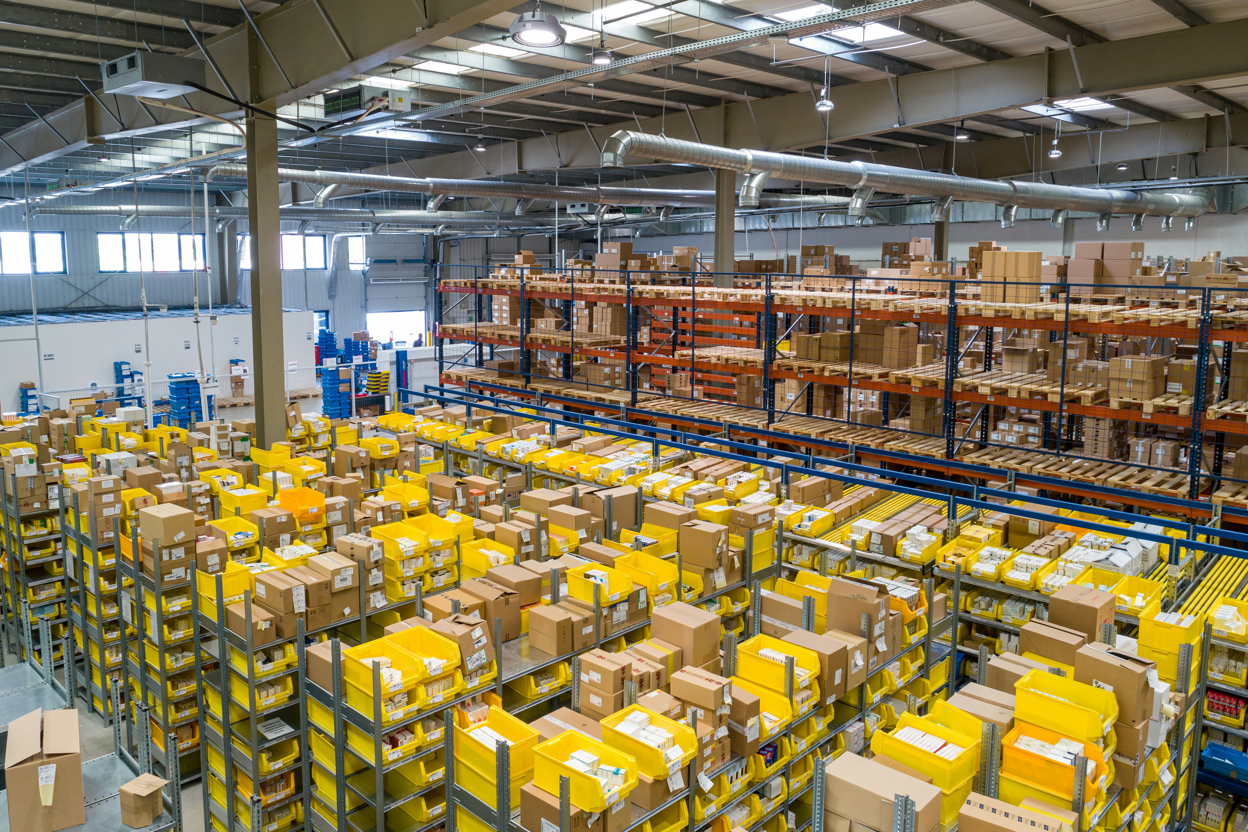Logistics warehouse with many small cartons and inventory bins